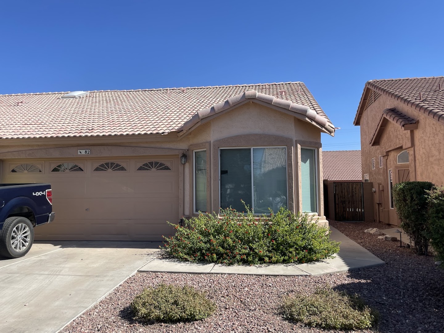 Arizona stucco home exterior with tile roof and desert landscaping